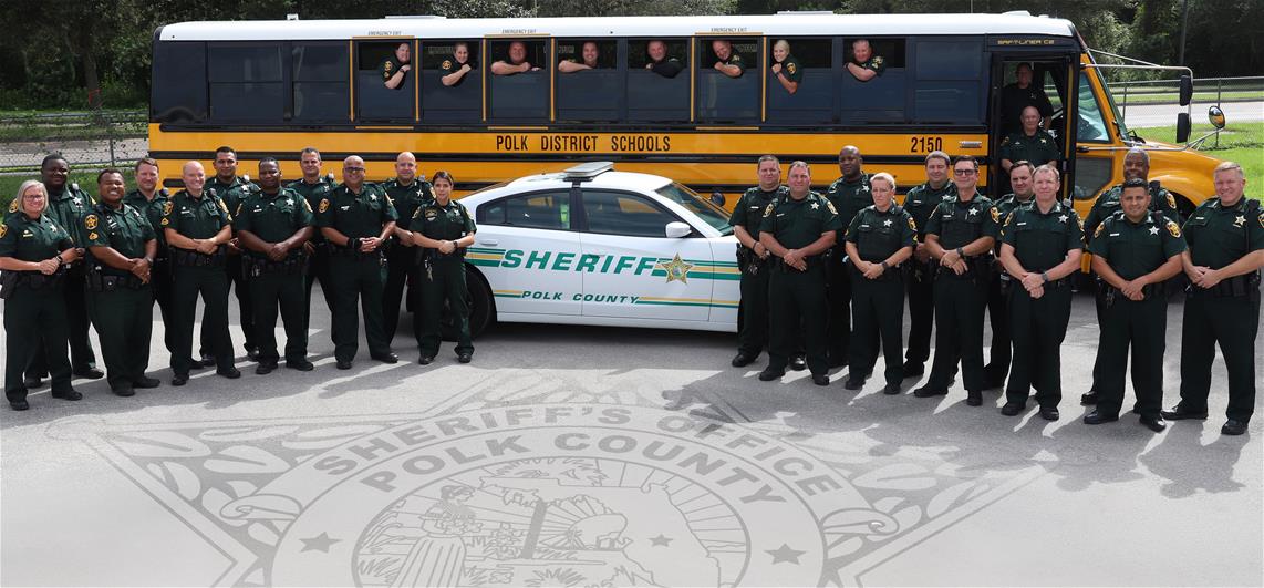 Deputies standing in front of school bus