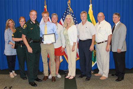 Tribute scholarship photo with sheriff